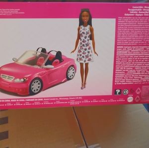 Barbie with pink convertible car